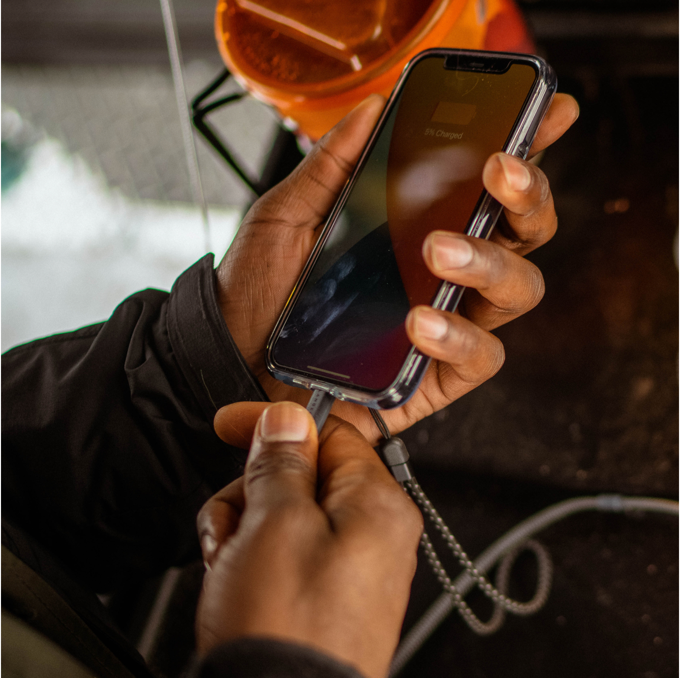 Man chargin phone with Glacier Case